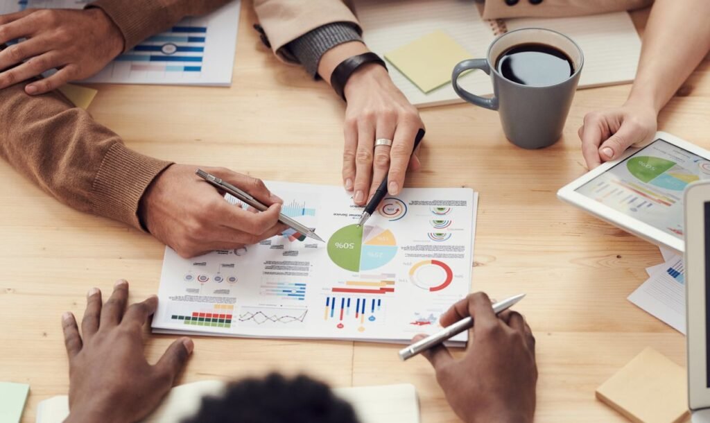 Stripe rachète OpenRouter pour plus de 7 milliards de dollars Colleagues discussing data strategy in an office meeting, Stripe OpenRouter acquisition